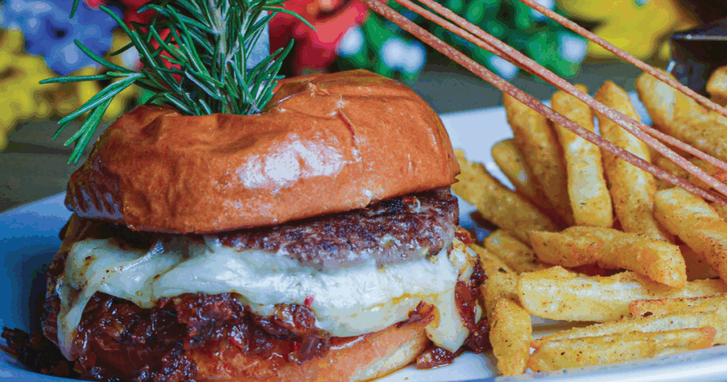 From Bacon Burger to Chai Lattes : What to Eat at Hash House Orlando Right Now 1 Bacon Onion Jam Burger with seasoned fries served at Hash House A Go Go Orlando on International Drive